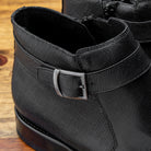 Side profile of the buckle of the 1221 Calzoleria Toscana Saffiano Leather Black Ankle Zip Boot