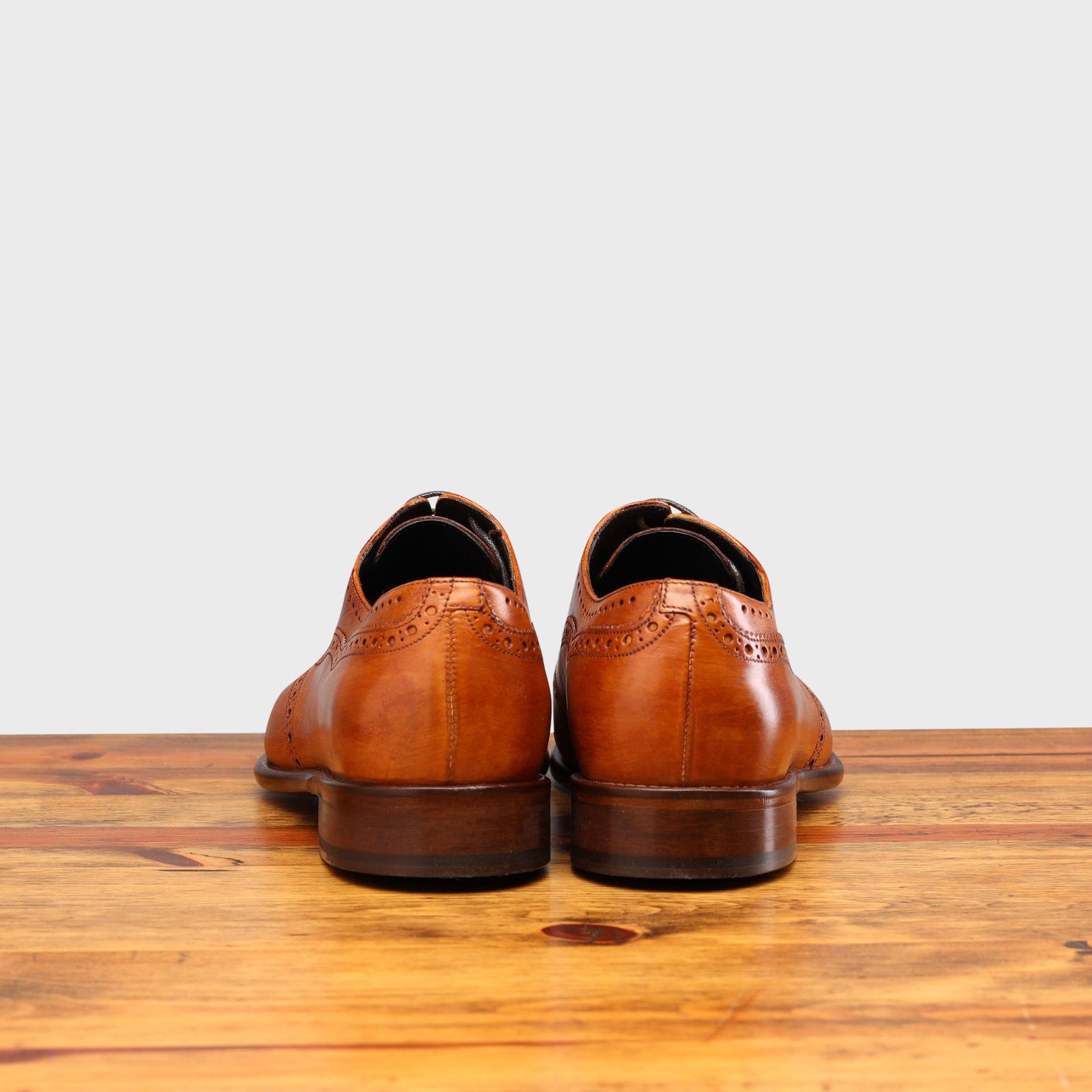 Back profile of H742 Calzoleria Toscana Dark Caramel Balmoral Lace-up on top of a wooden table