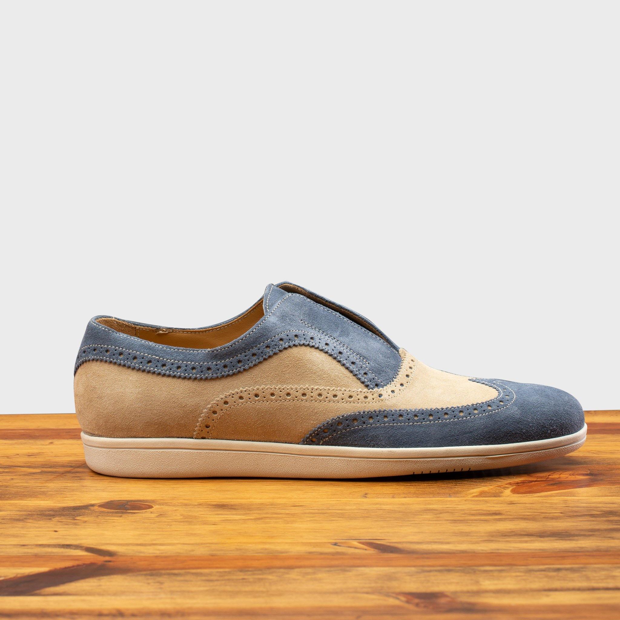 Side profile of the 4445 Calzoleria Toscana Suede Slip-On on top of a wooden table