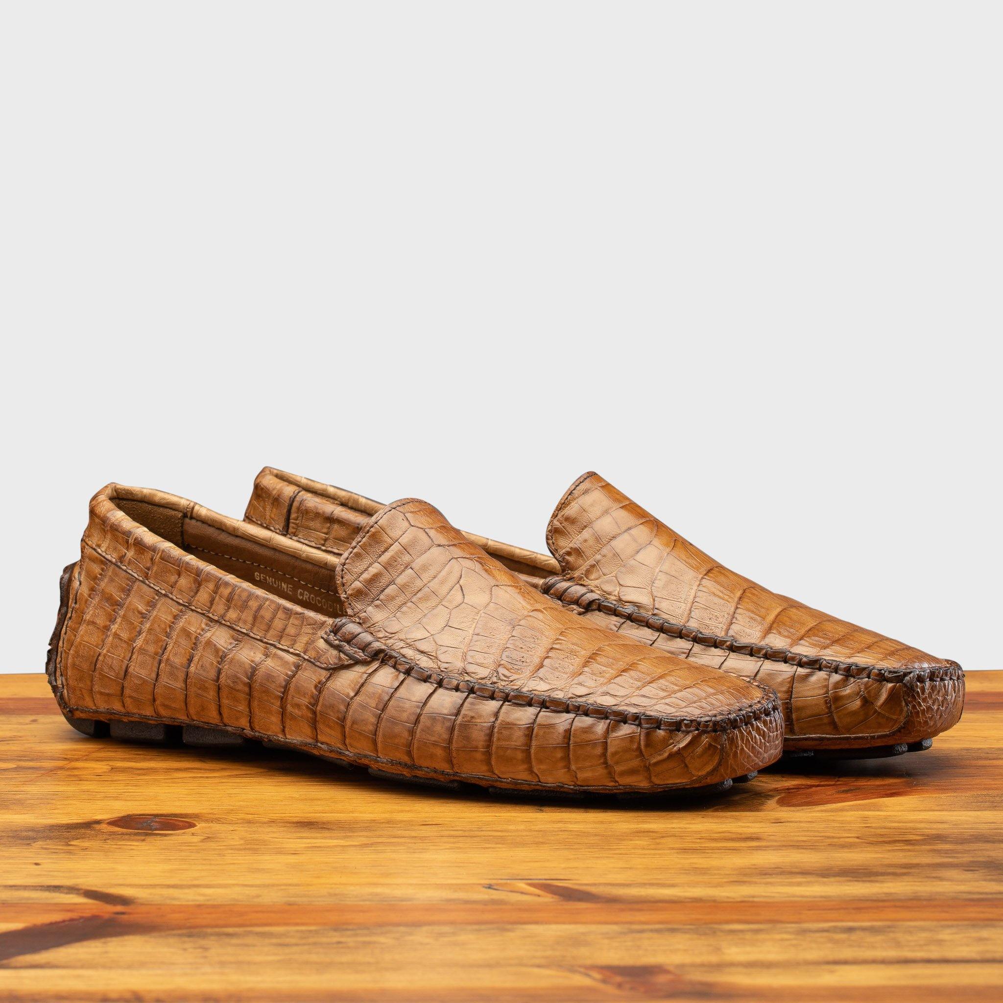 Pair of 4551 Calzoleria Toscana Cerris Crocodile Dip-Dyed Driver on top of a wooden table