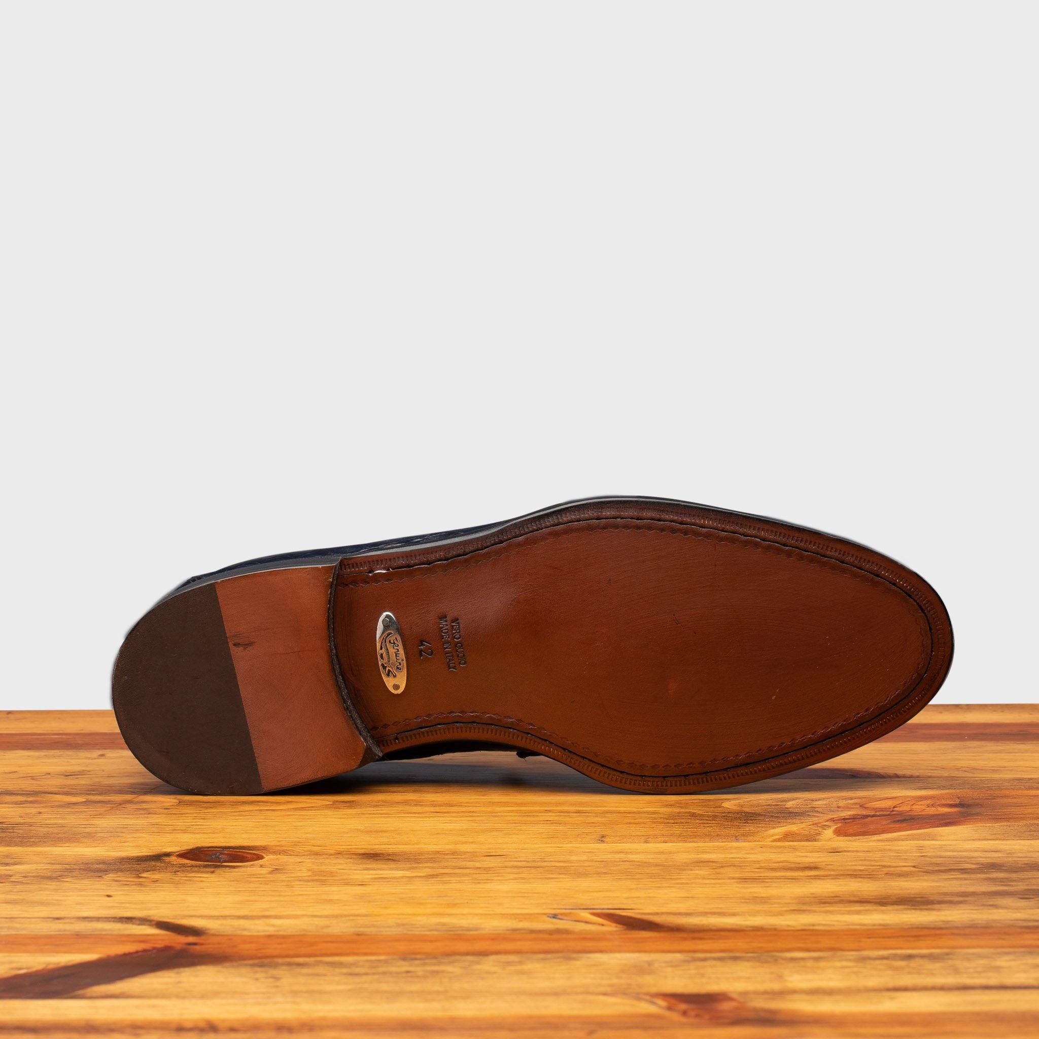 Full leather outsole showing plate of authenticity of genuine crocodile skin and ¾ of the heel covered in rubber of 5034 Calzoleria Toscana Ocean Blue Crocodile Slip-On