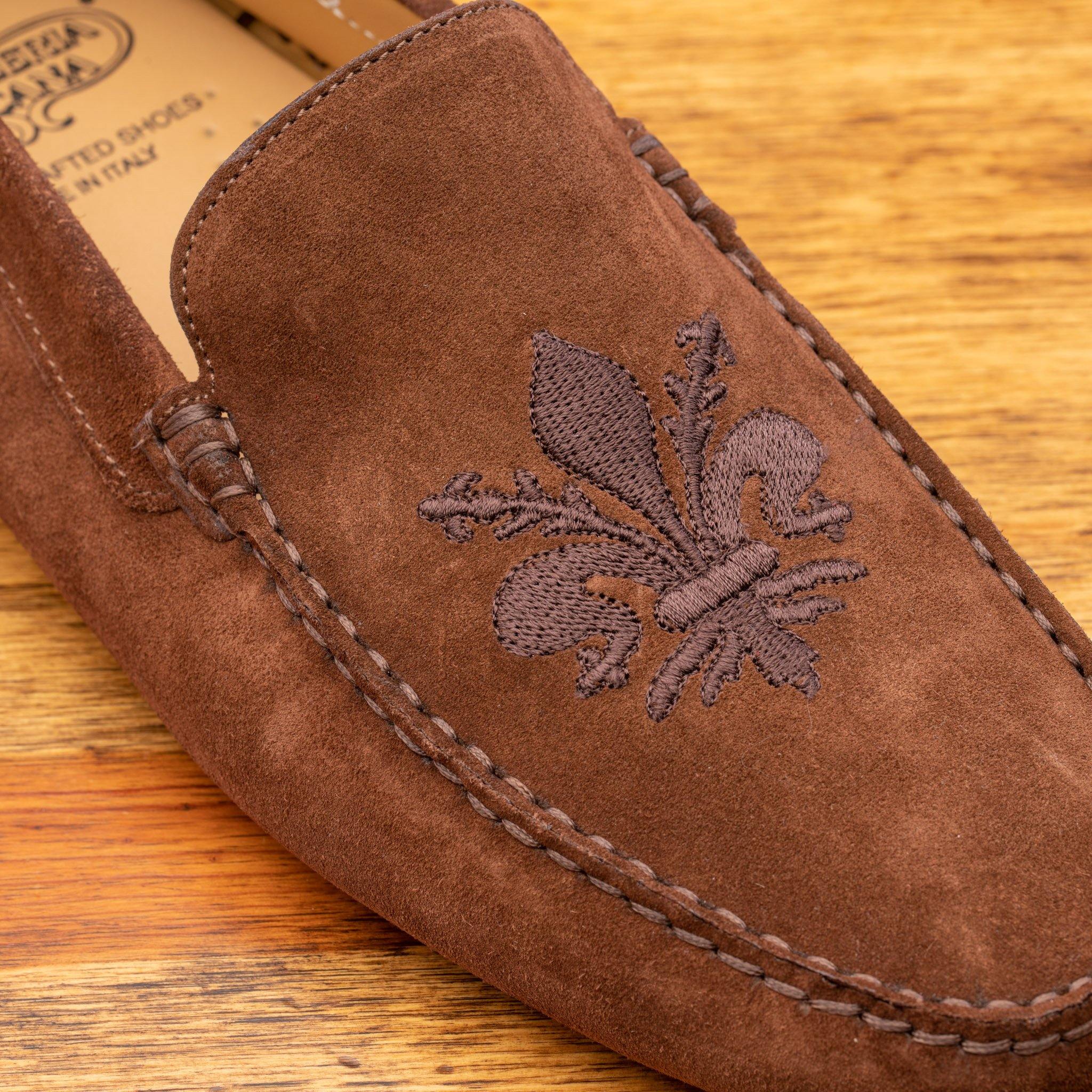 Up close picture of the tone on tone embroidered fleur de lis on 5303 Calzoleria Toscana Brick Venetian Suede Driver
