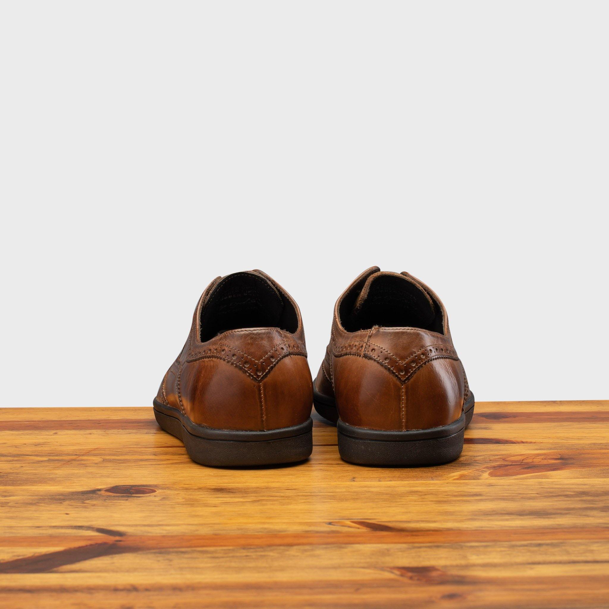 Back profile of 7839 Calzoleria Toscana Cerris Elba Slip-On on top of a wooden table