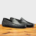 Pair of 8675 Calzoleria Toscana Blue Ostrich and Alligator Driver on top of a wooden table