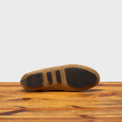 Full Rubber Outsole of 8976 Calzoleria Toscana Women's Rope Suede Driver on top of a wooden table