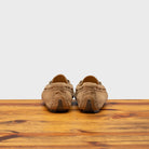 Back profile of 8976 Calzoleria Toscana Women's Rope Suede Driver on top of a wooden table