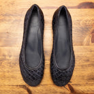 Pair of B940 Calzoleria Toscana Navy Melania Ballerina laying flat showing the branded name insole on top of a wooden table