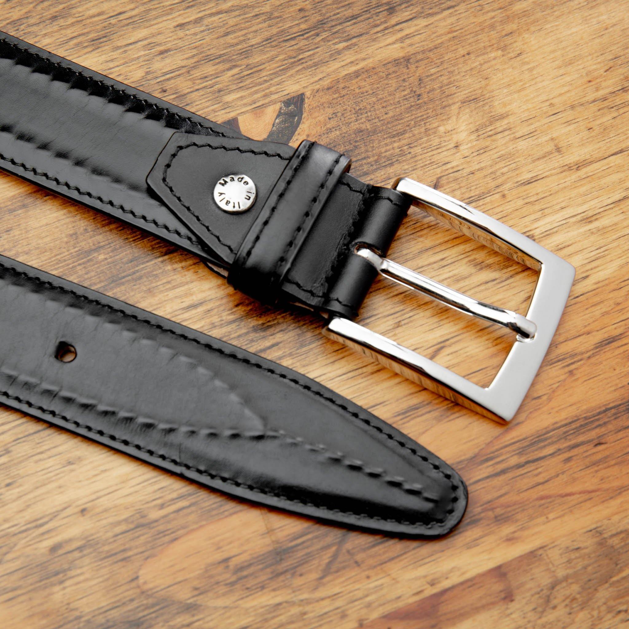 Up close picture of C2216 Calzoleria Toscana Black Inner Stitched Dress Belt on top of a wooden table