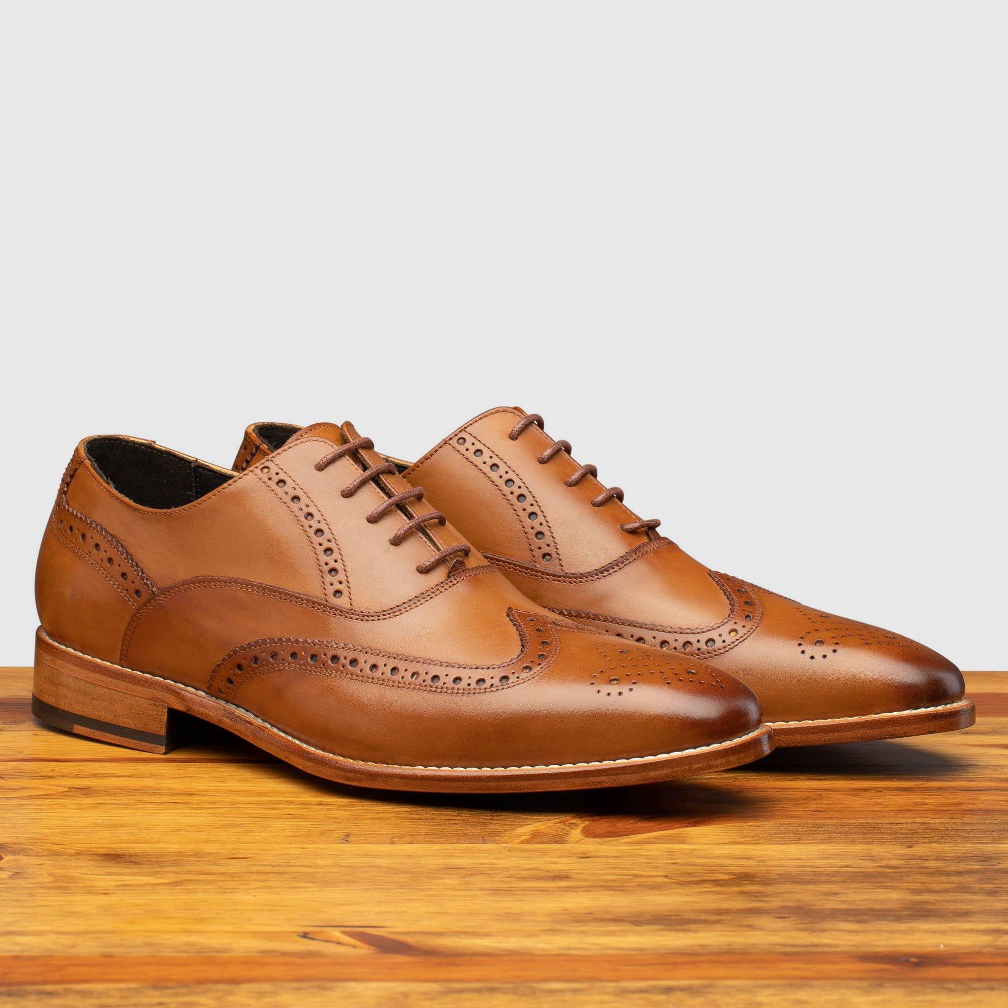 Profile of H310 Calzoleria Toscana Chester Onice Wingtip Balmoral on top of a wooden table
