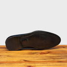 Full leather outsole of H742 Calzoleria Toscana Blue Balmoral Lace-up on top of a wooden table