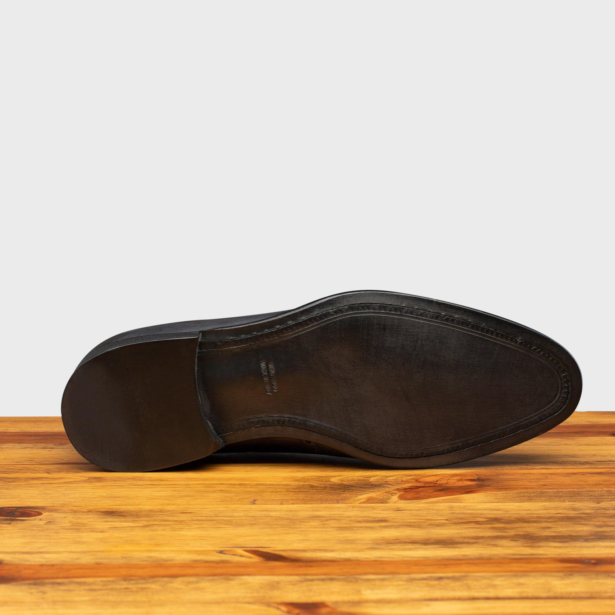 Full leather outsole of H742 Calzoleria Toscana Grey Balmoral Lace-up on top of a wooden table