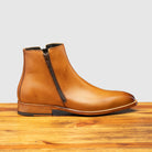 Side profile showing functional zipper  of Q337 Calzoleria Toscana Chester Onice Double Zipper Boot on top of a wooden table