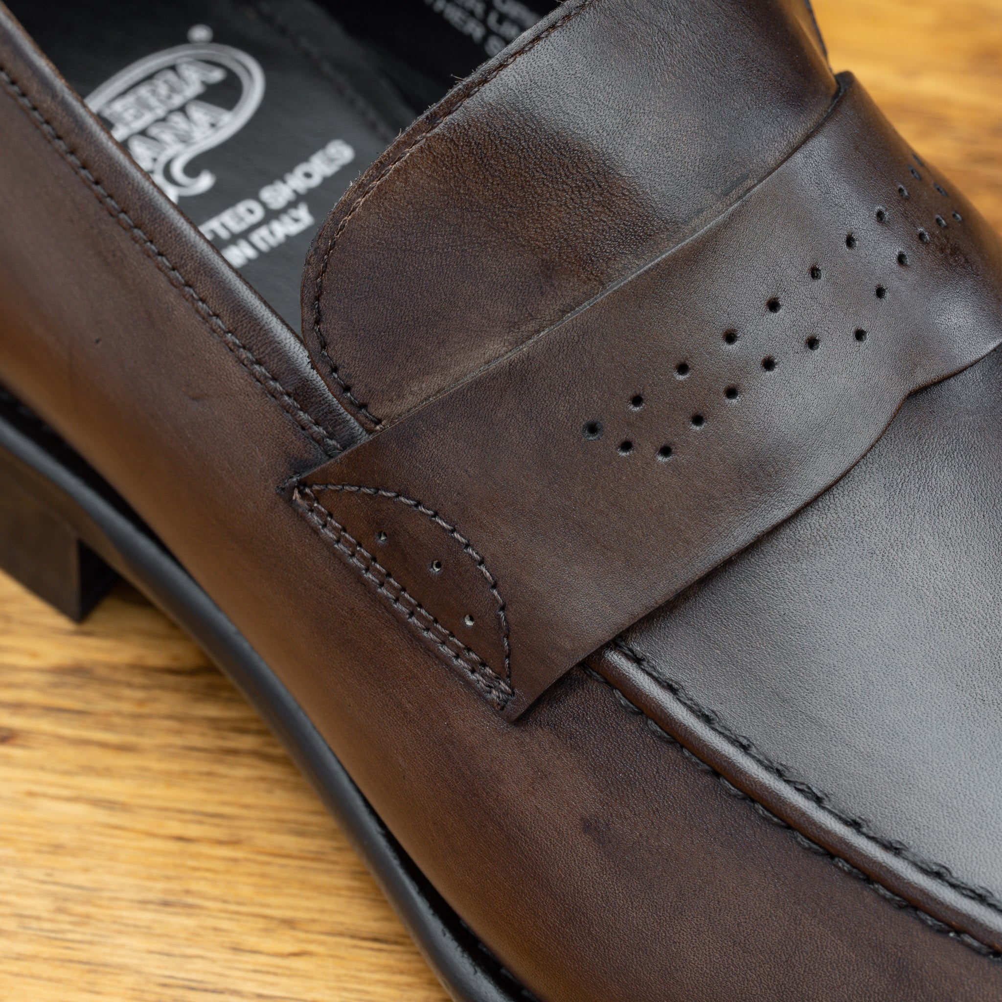 Moor leather loafer on a wooden surface