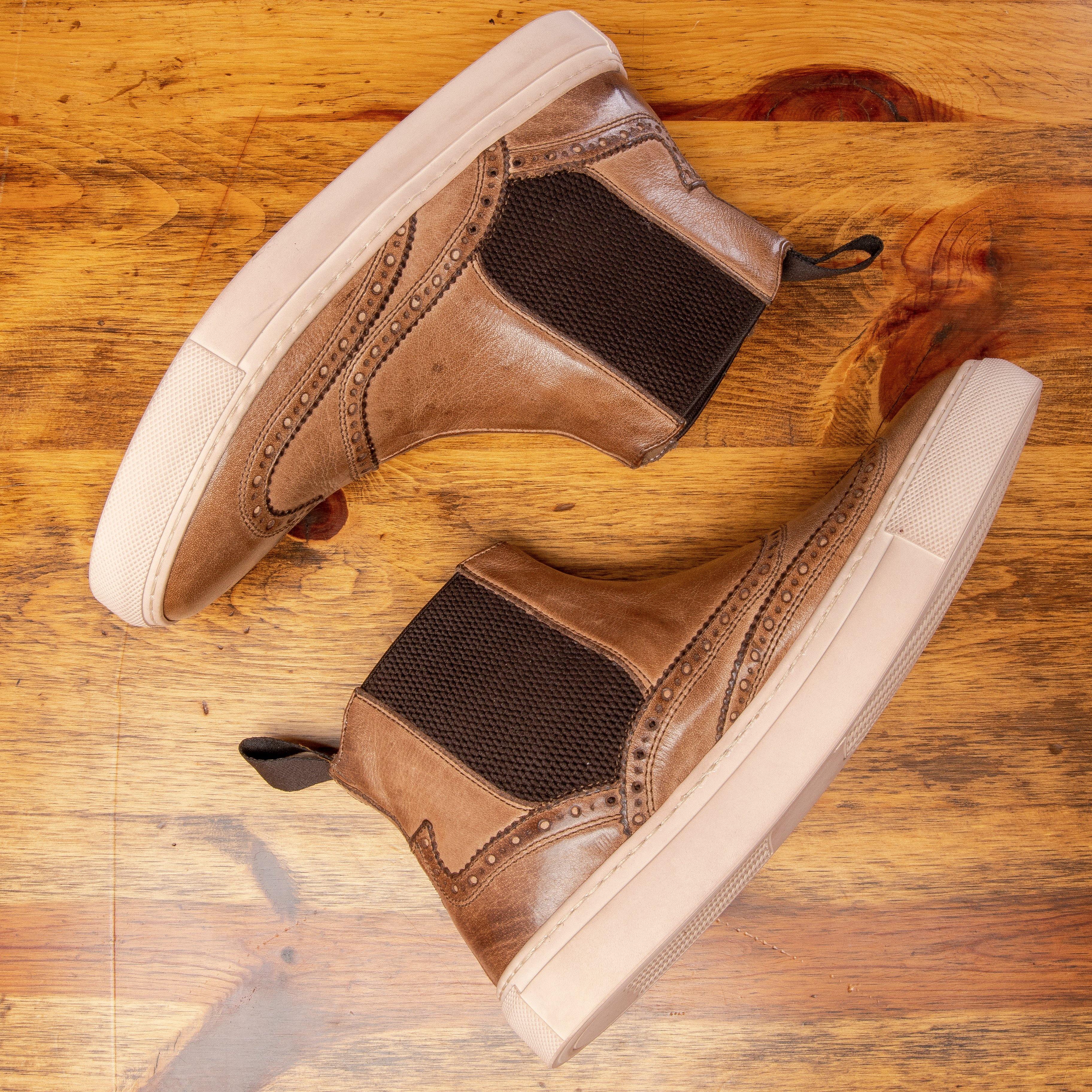 Pair of D741 Calzoleria Toscana Women's Moor Ankle Sneaker laying down and showing the side profile