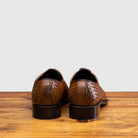 Back profile of 5373 Calzoleria Toscana Chestnut Woven Lace-Up on top of a wooden table