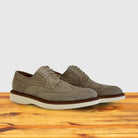 A pair of Chashmere suede shoe  on a wooden surface