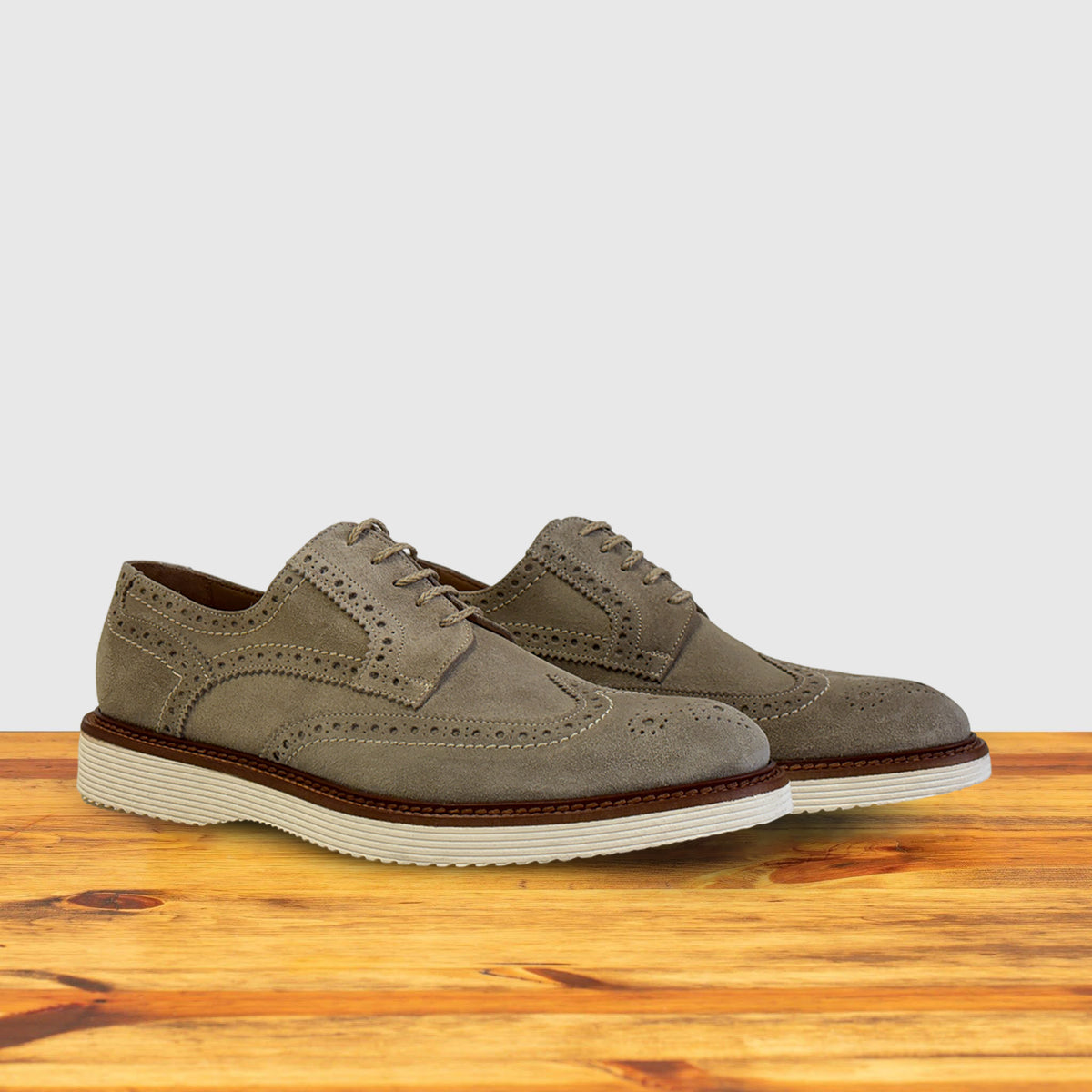 A pair of Chashmere suede shoe  on a wooden surface