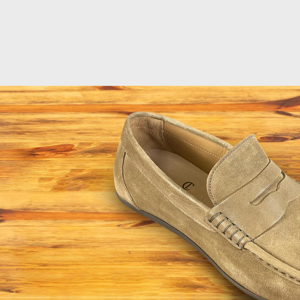 Rope color loafer shoe on a wooden surface