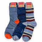 Three pairs of men's mid calf ocks displayed together on a white background. The left pair features navy and blue horizontal stripes with bright orange toes and heels.