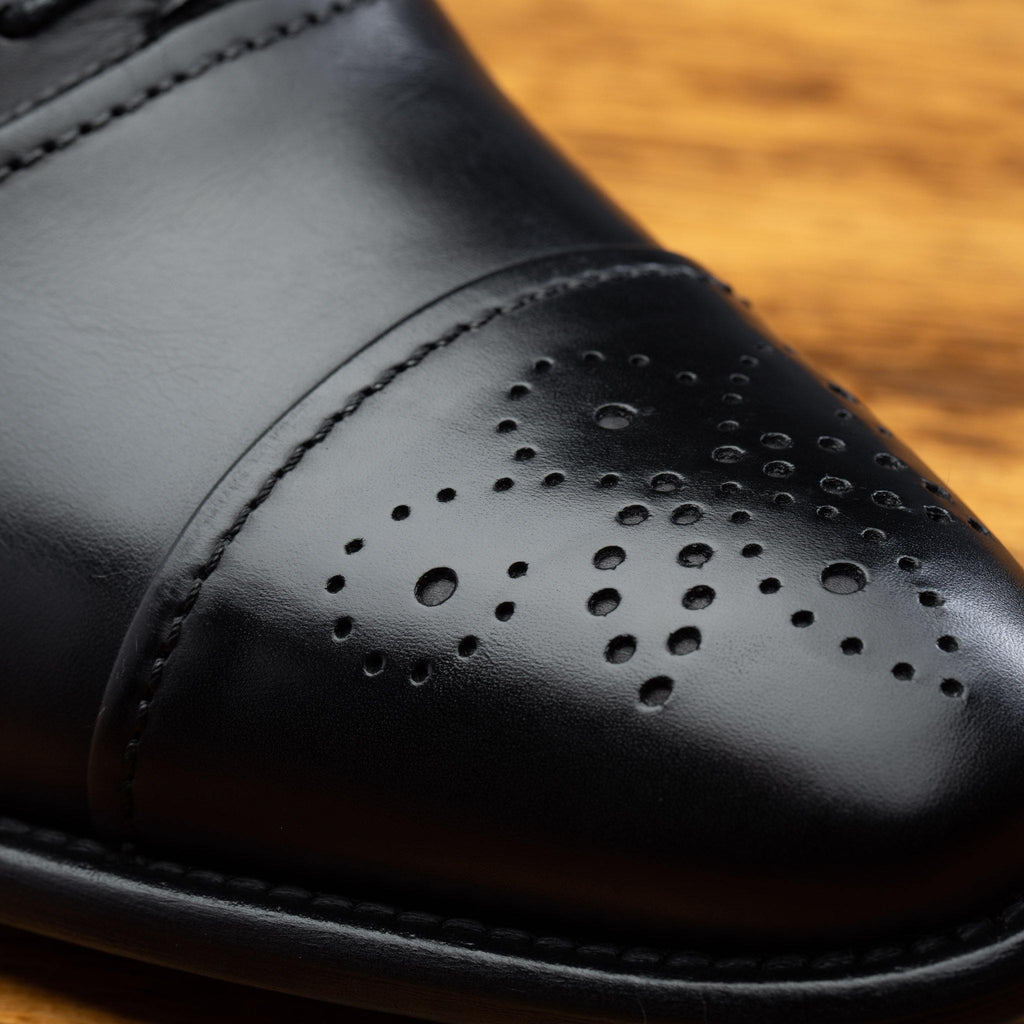 Up close picture of the Medallion Toe of the 2361 Calzoleria Toscana  Black Cayenne Calf Cap Toe