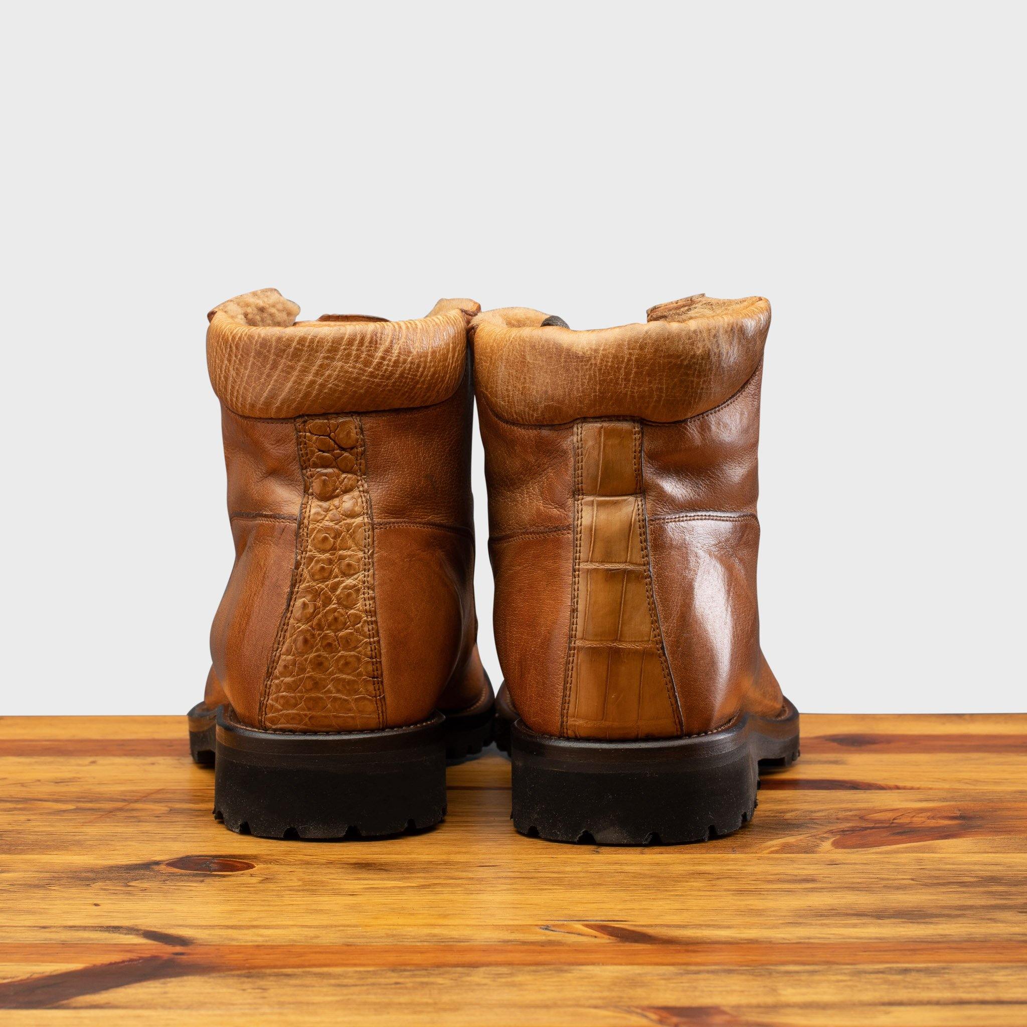 Back profile of the 3236 Calzoleria Toscana Brick Shearling Boot on top of a wooden table