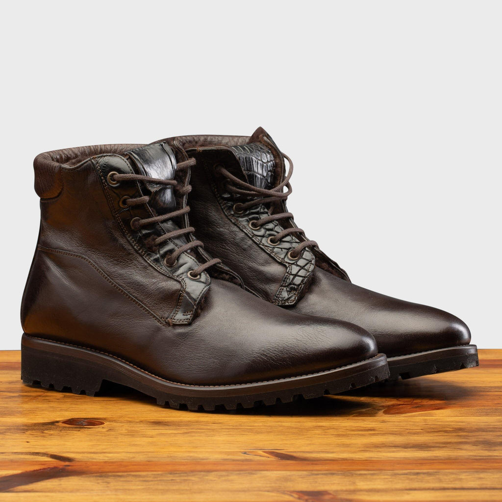 Pair of the 3236 Calzoleria Toscana Dark Brown Shearling Boot on top of a wooden table