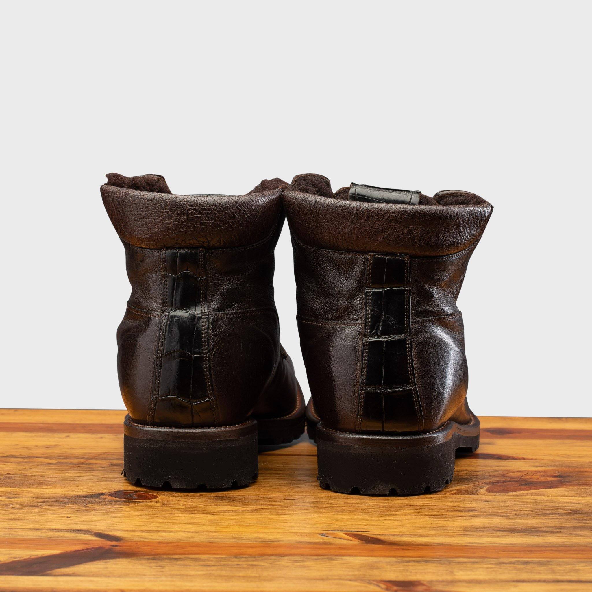 Back profile of the 3236 Calzoleria Toscana Dark Brown Shearling Boot on top of a wooden table
