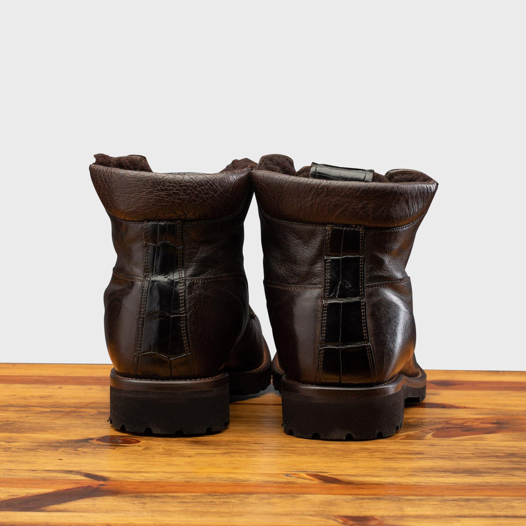 Back profile of the 3236 Calzoleria Toscana Dark Brown Shearling Boot on top of a wooden table