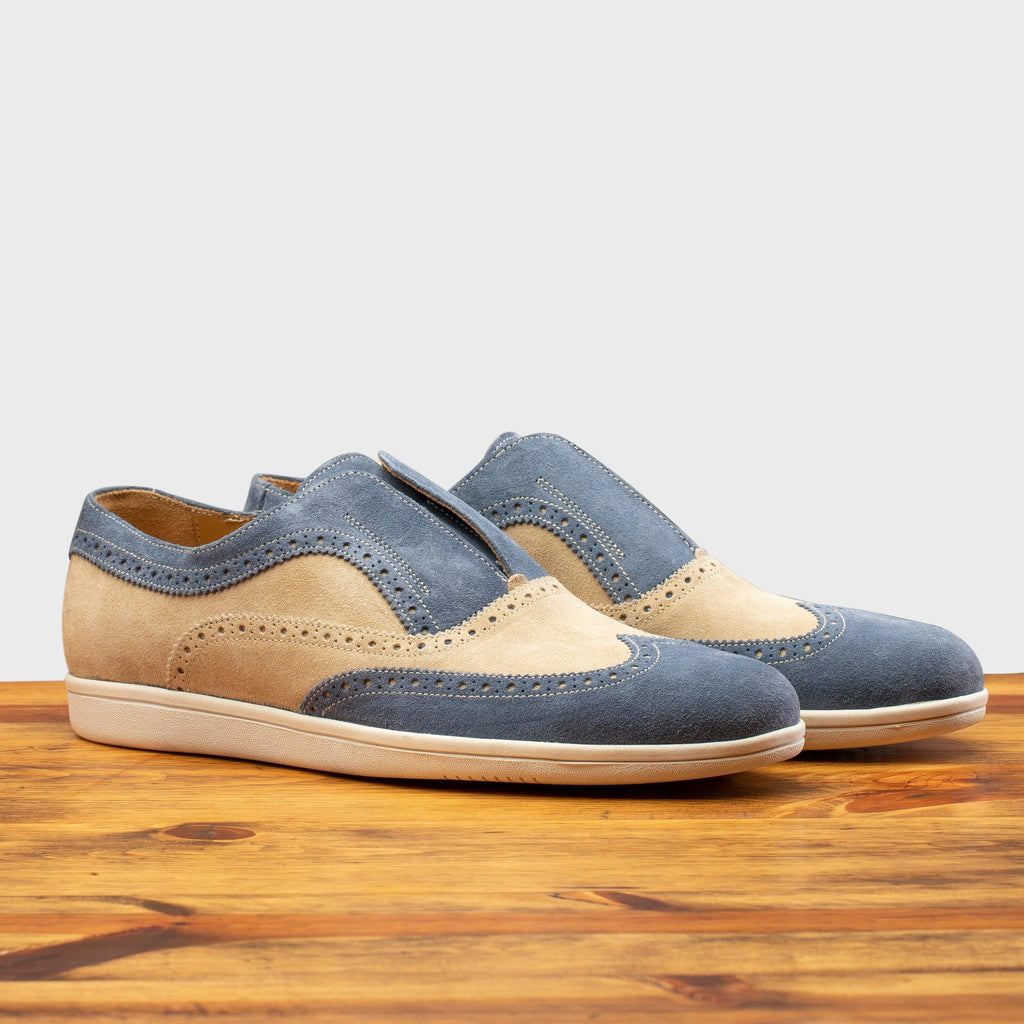 Pair of the 4445 Calzoleria Toscana Suede Slip-On on top of a wooden table