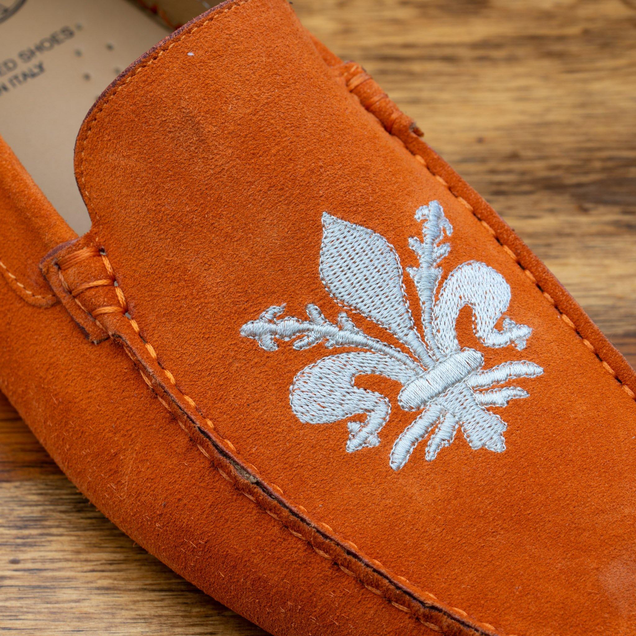 Up close picture of cream embroidered fleur di lis on 5303 Calzoleria Toscana Papaya Venetian Suede Driver