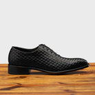 Side profile of 5373 Calzoleria Toscana Black Woven Lace-up on top of a wooden table