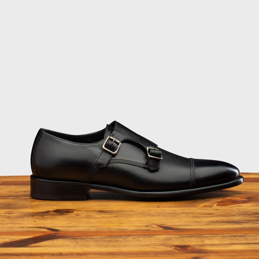 Side profile of 6582 Calzoleria Toscana Black Monkstrap Cap Toe on top of a wooden table