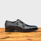 Side profile of 6582 Calzoleria Toscana Blue Monstrap Cap Toe on top of a wooden table