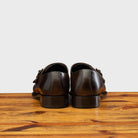 A Pair of  Moor monk strap cap toe shoe with double straps, displayed on a wooden surface.