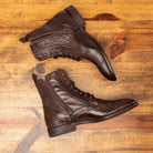 Sid profile of the pair of boots showing the functional zipper on 7149 Calzoleria Toscana Women's Brown Dip-Dyed Diver Combat Boot on top of a wooden table
