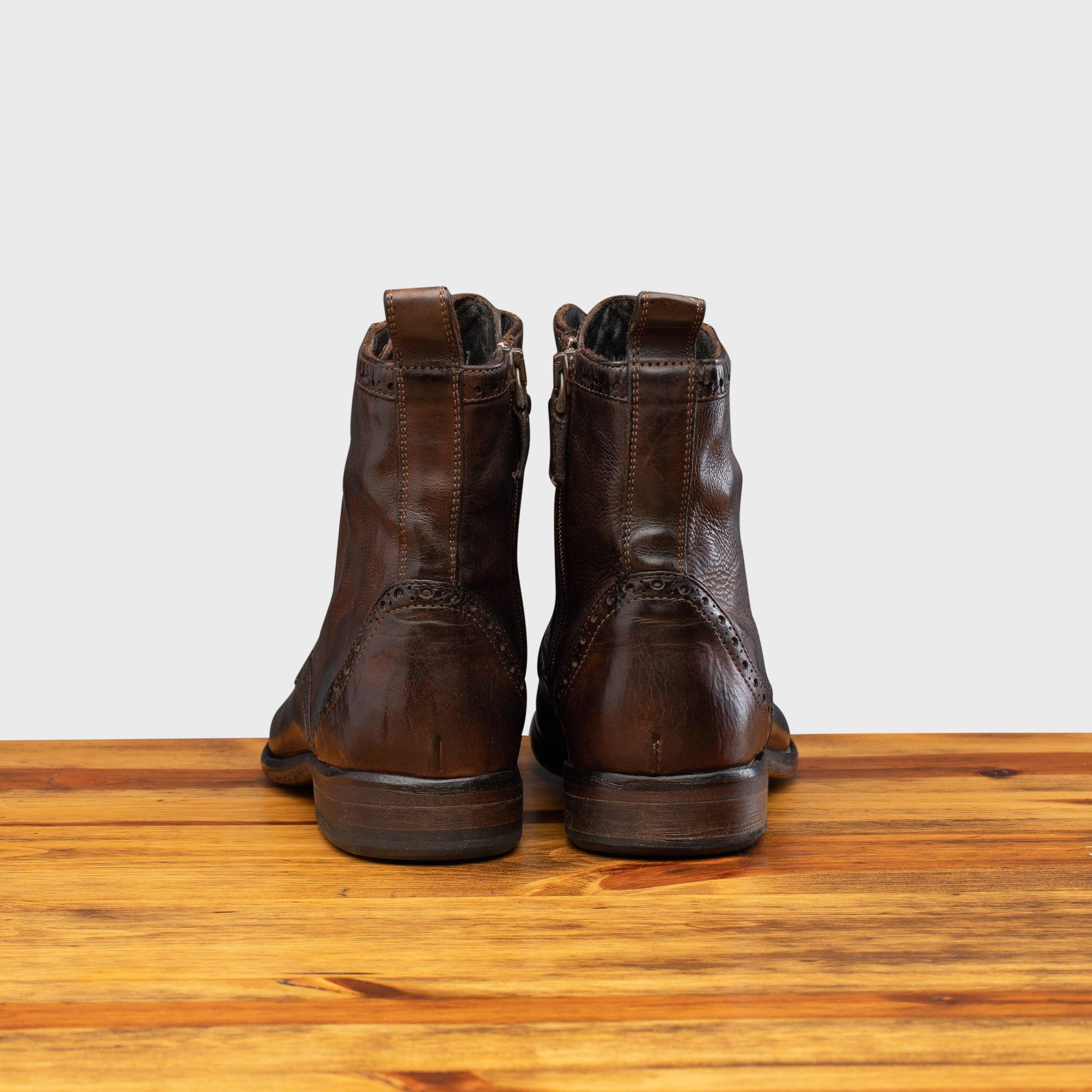 Back profile of 7149 Calzoleria Toscana  Women's Brown Diver Combat Boot on top of a wooden table