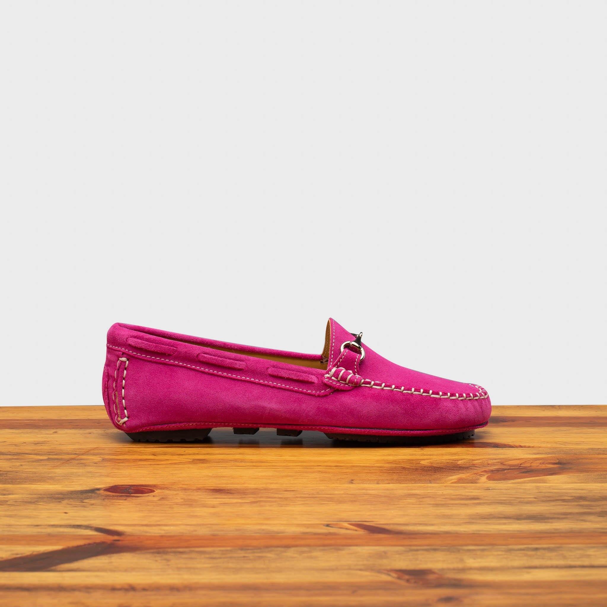 Side profile of 8976 Calzoleria Toscana Women's Fuschia Suede Driver on top of a wooden table