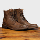 Pair of 9147 Calzoleria Toscana Moor Dip-Dyed Cesar Boot on top of a wooden table