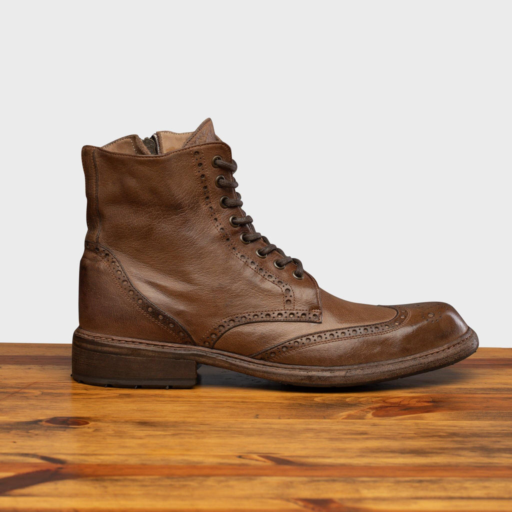 Side profile of 9147 Calzoleria Toscana Moor Dip-Dyed Cesar Boot on top of a wooden table