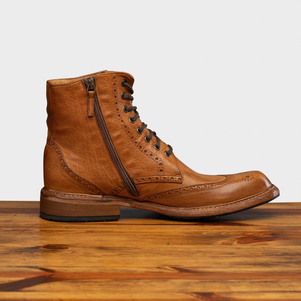 Side profile of 9147 Calzoleria Toscana Brick Dip-Dyed Cesar Boot on top of a wooden table