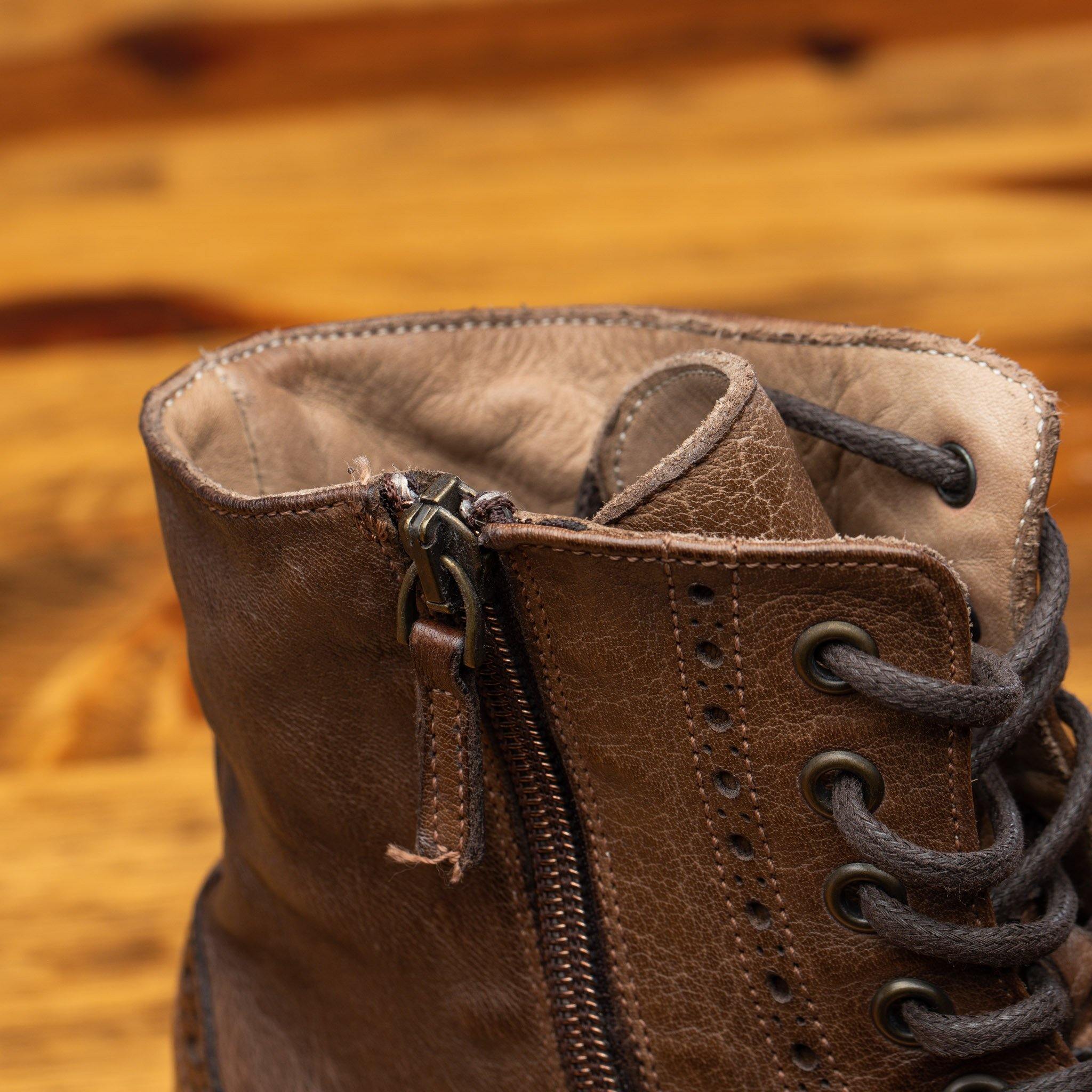 Moor leather boots on a wooden surface