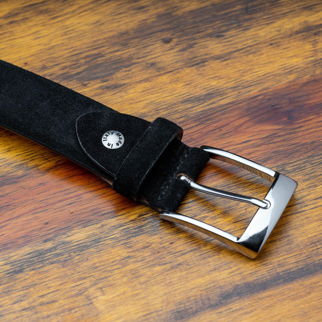 Up close photo of the silver buckle and tip C1359-S Calzoleria Toscana Black Velour Suede Belt on top of a wooden table