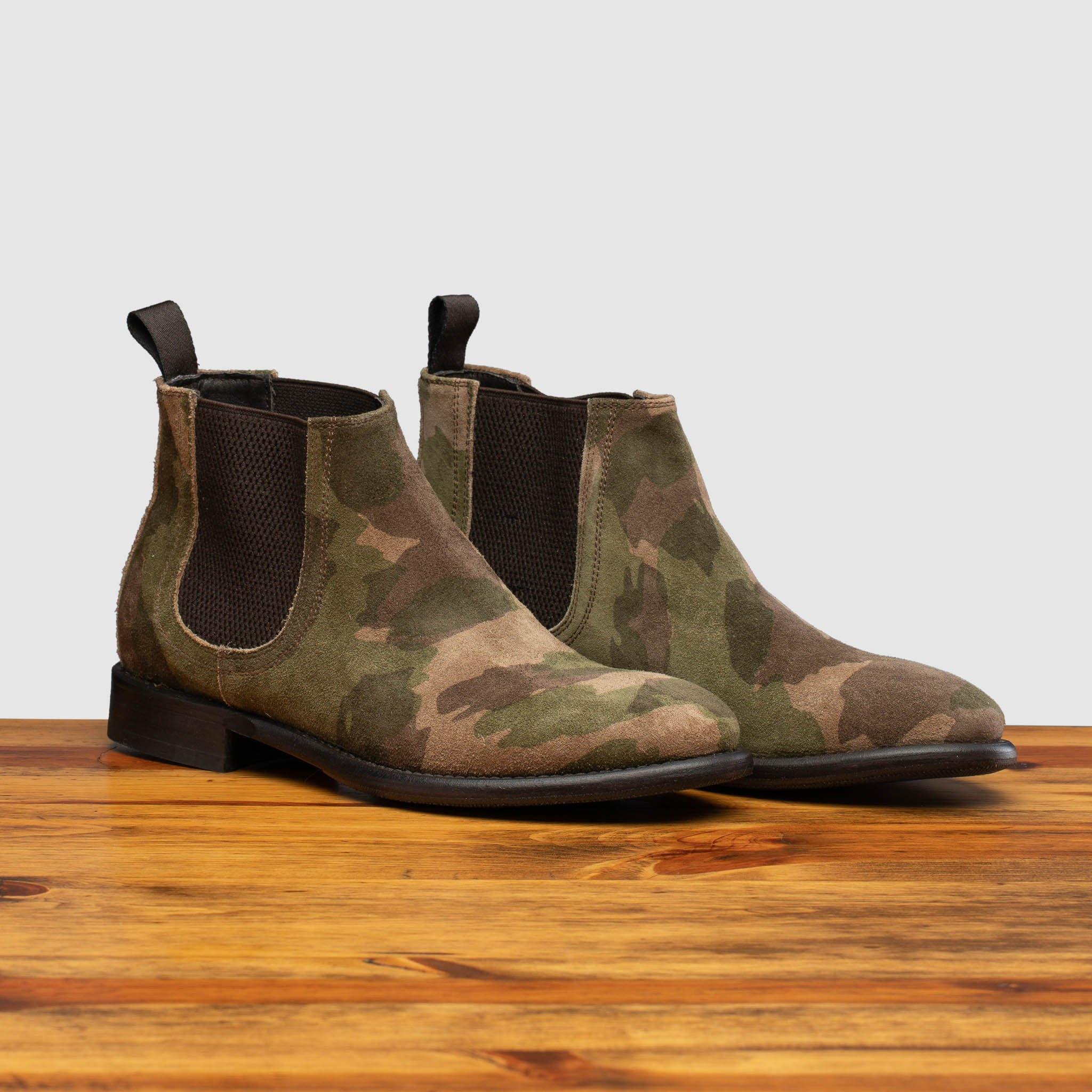 Pair of D681 Calzoleria Toscana Posta Donna Boot in Camoflauge on top of a wooden table