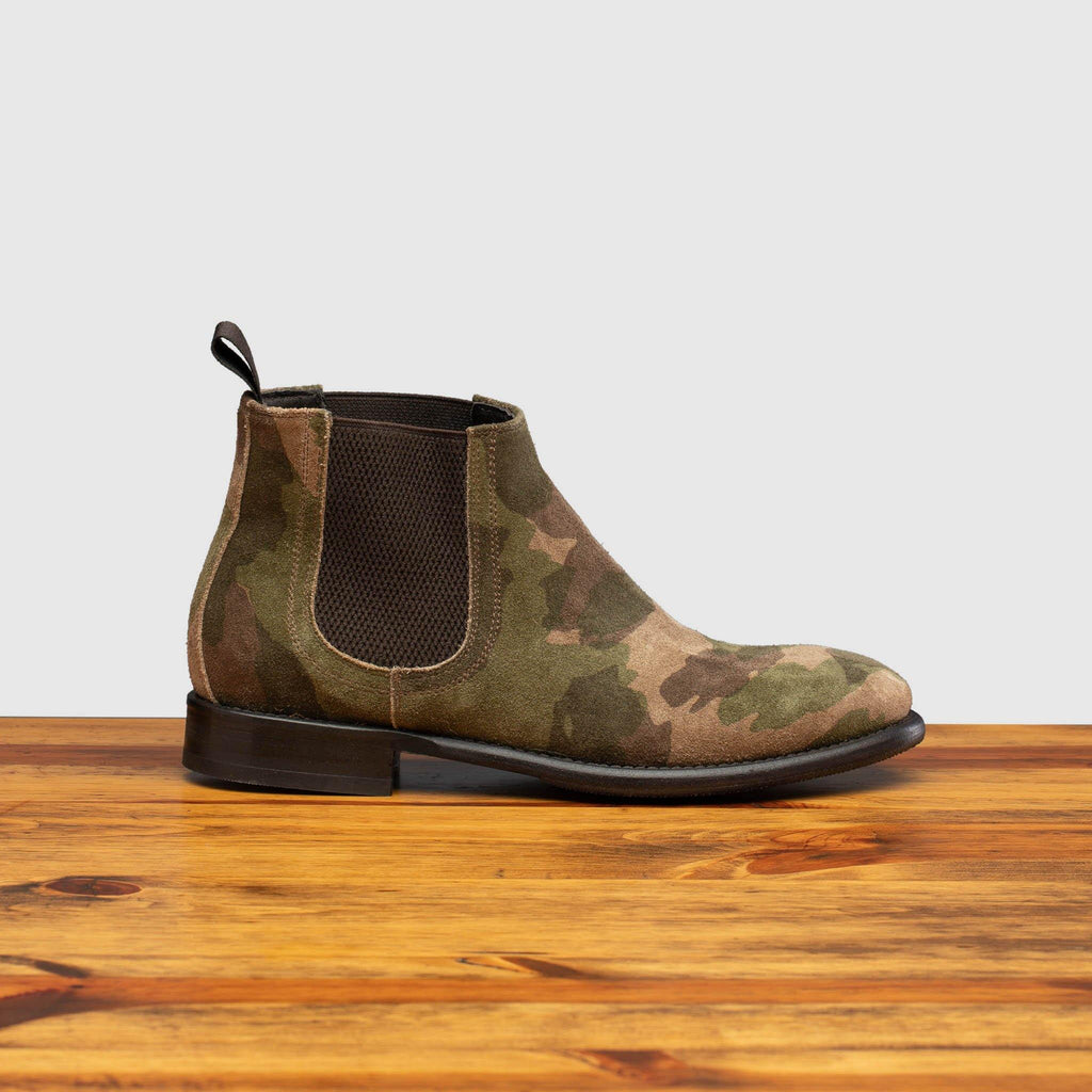 Side profile of D681 Calzoleria Toscana Posta Donna Boot in Camoflauge on top of a wooden table 