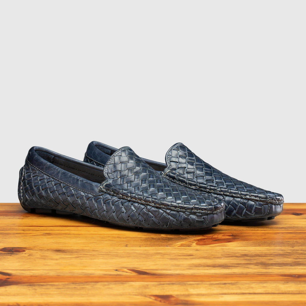 Profile of E945 Calzoleria Toscana Denim Blue New Rendo Woven Driver on top of a wooden table