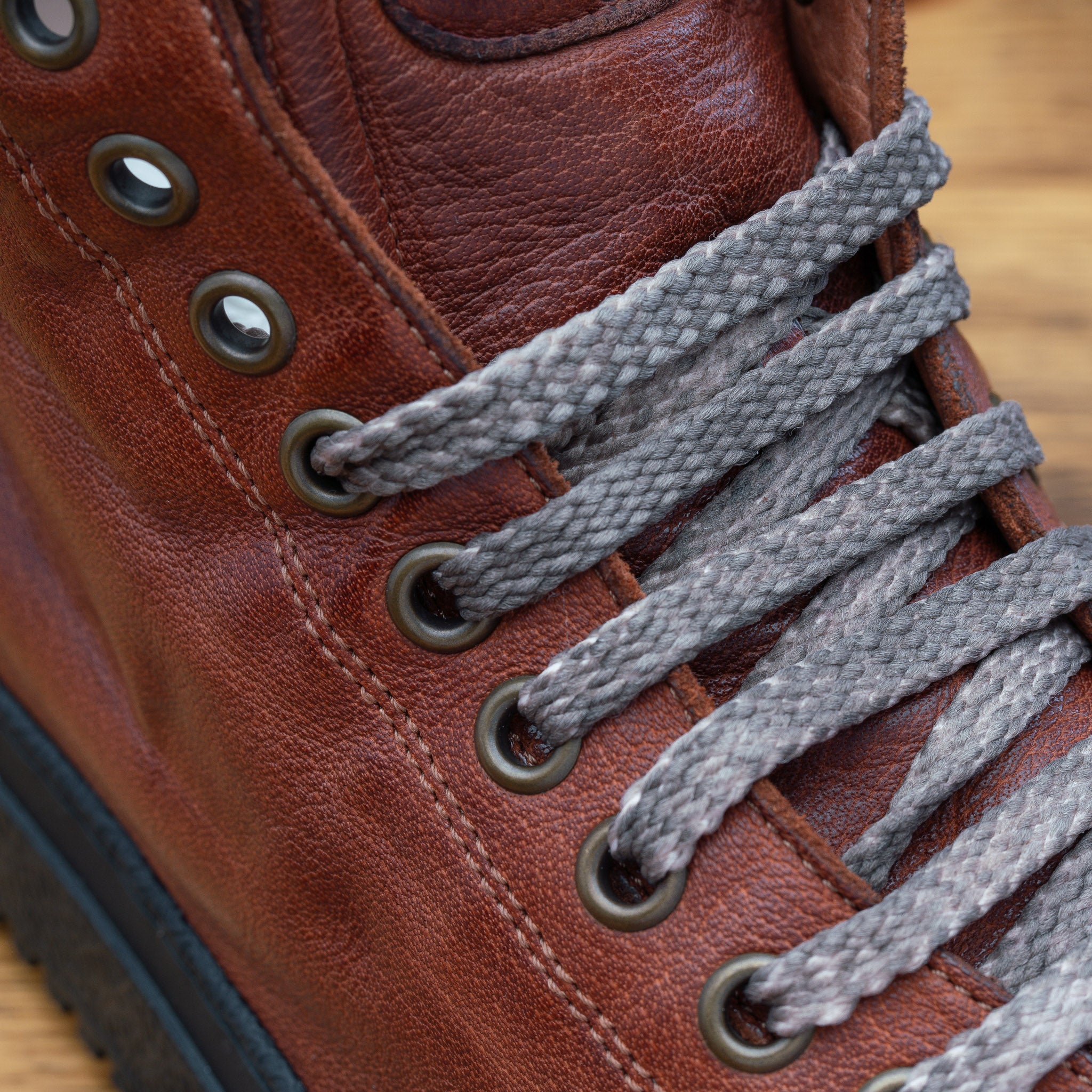 Up close picture of the vamp showing the 10 eyelet of H883 Calzoleria Toscana Coker High Top Benso Sneaker
