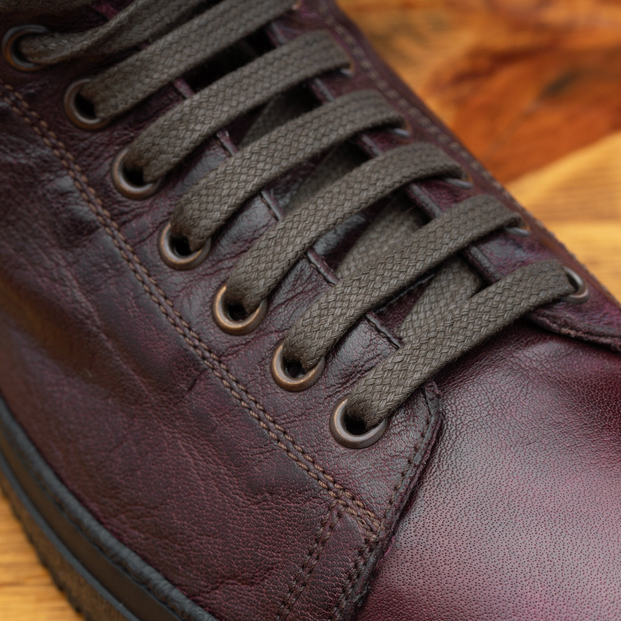 Up close picture of the vamp showing the 10 eyelet of H883 Calzoleria Toscana Liver High Top Benso Sneaker