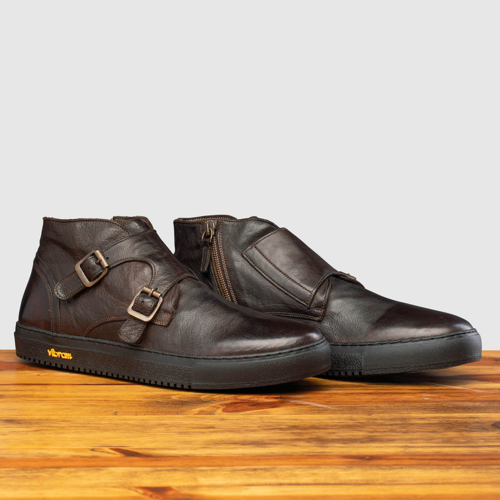 Pair of H884 Calzoleria Toscana Dark Brown Dip-Dyed Double Strap Sneaker on top of a wooden table