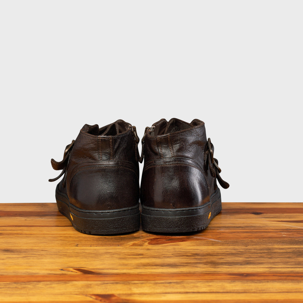 Back profile of H884 Calzoleria Toscana Dark Brown Dip-Dyed Double Strap Sneaker on top of a wooden table