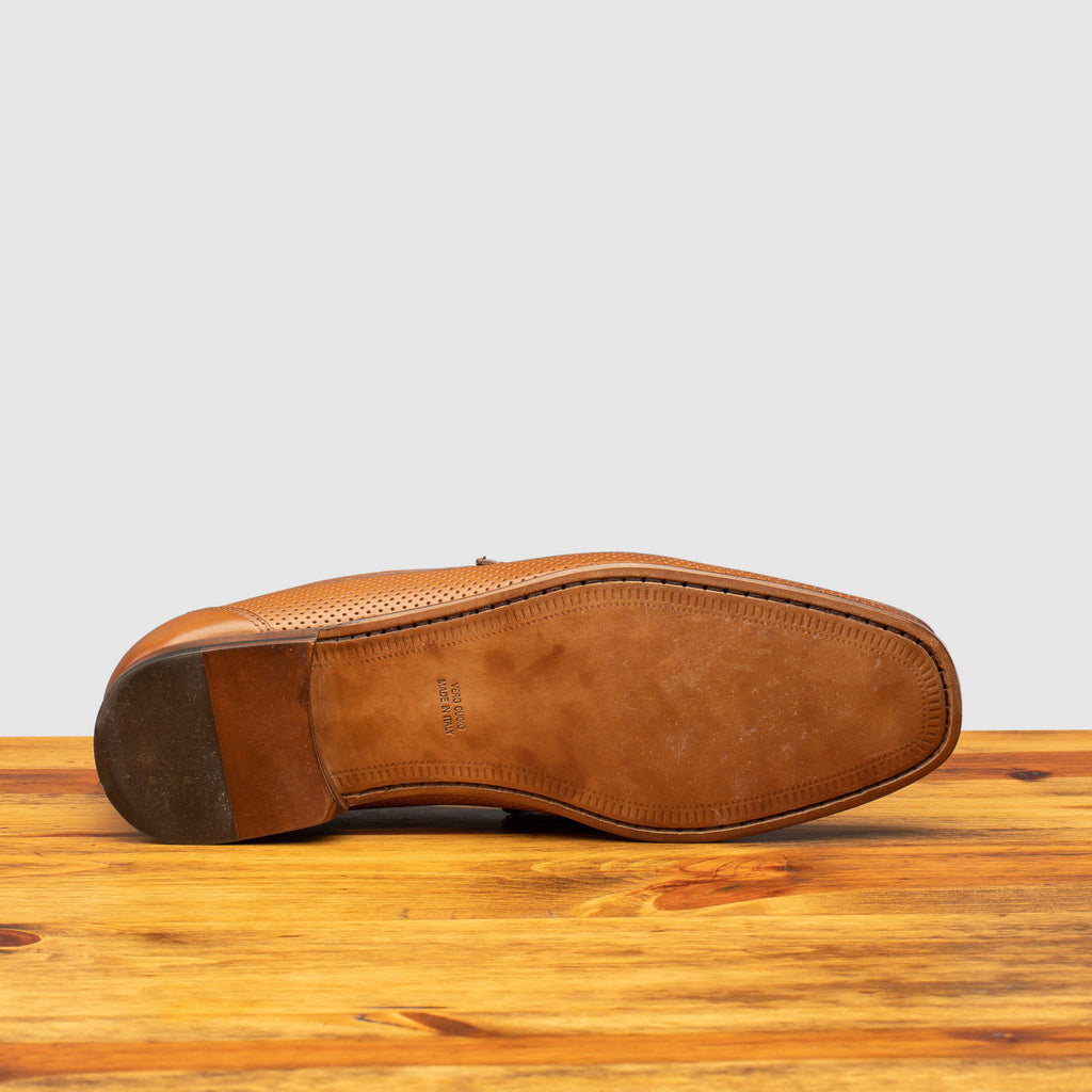 Full leather outsole of Q479-M Calzoleria Toscana Tony-M Loafer on top of a wooden table